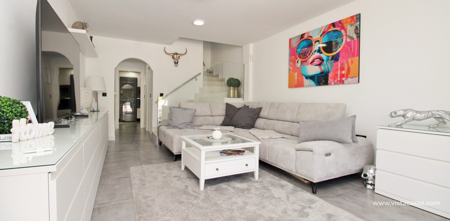 Beachside semi-detached house for sale in Mil Palmeras with private swimming pool lounge