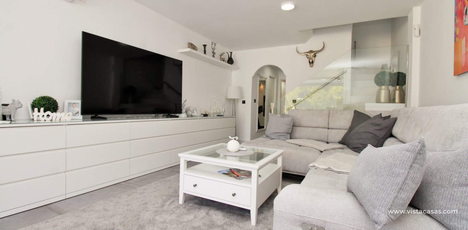 Beachside semi-detached house for sale in Mil Palmeras with private swimming pool lounge 2