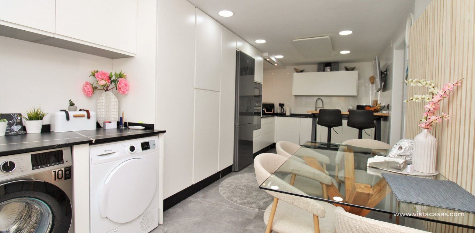Beachside semi-detached house for sale in Mil Palmeras with private swimming pool kitchen