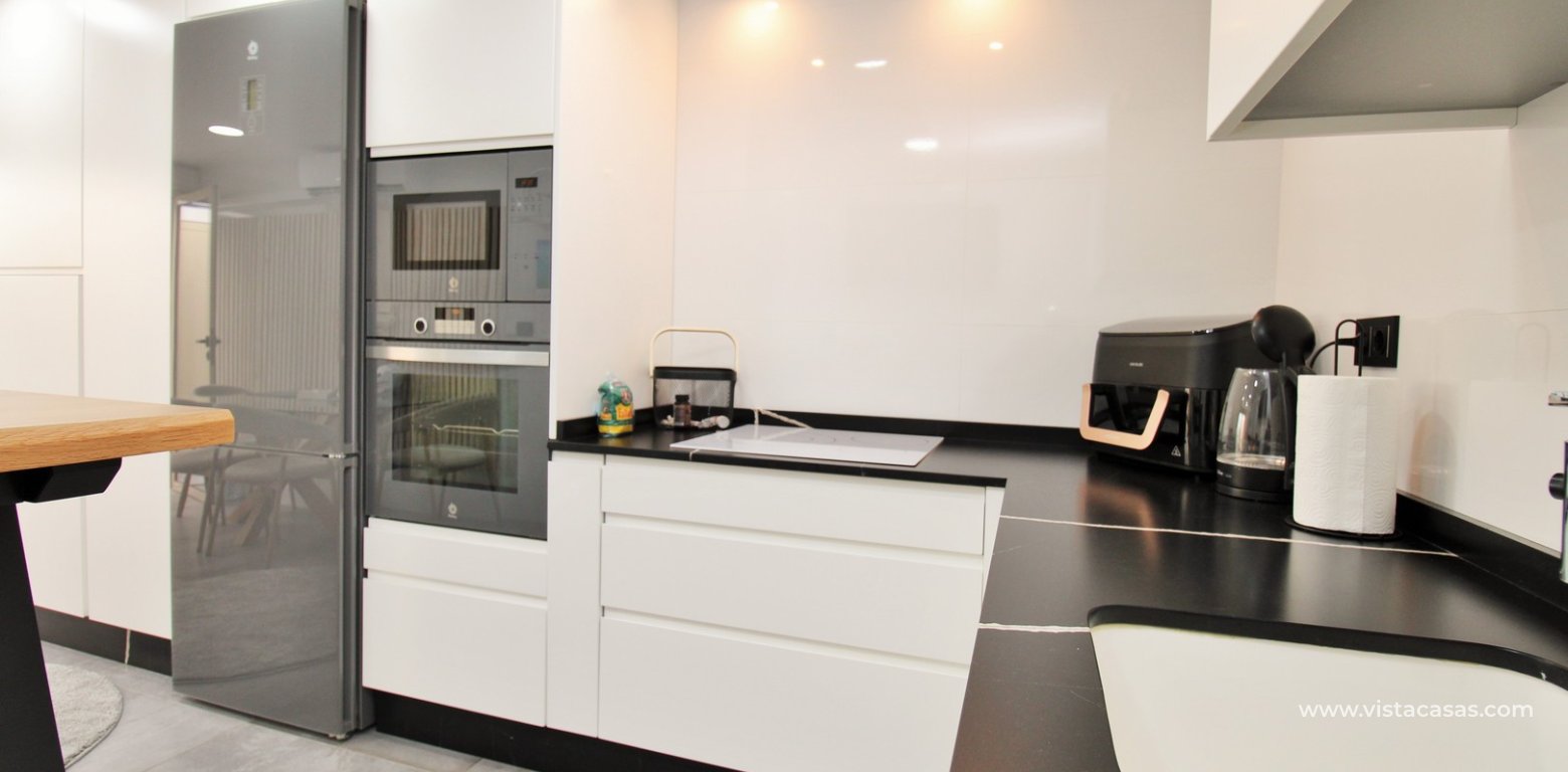 Beachside semi-detached house for sale in Mil Palmeras with private swimming pool kitchen modern