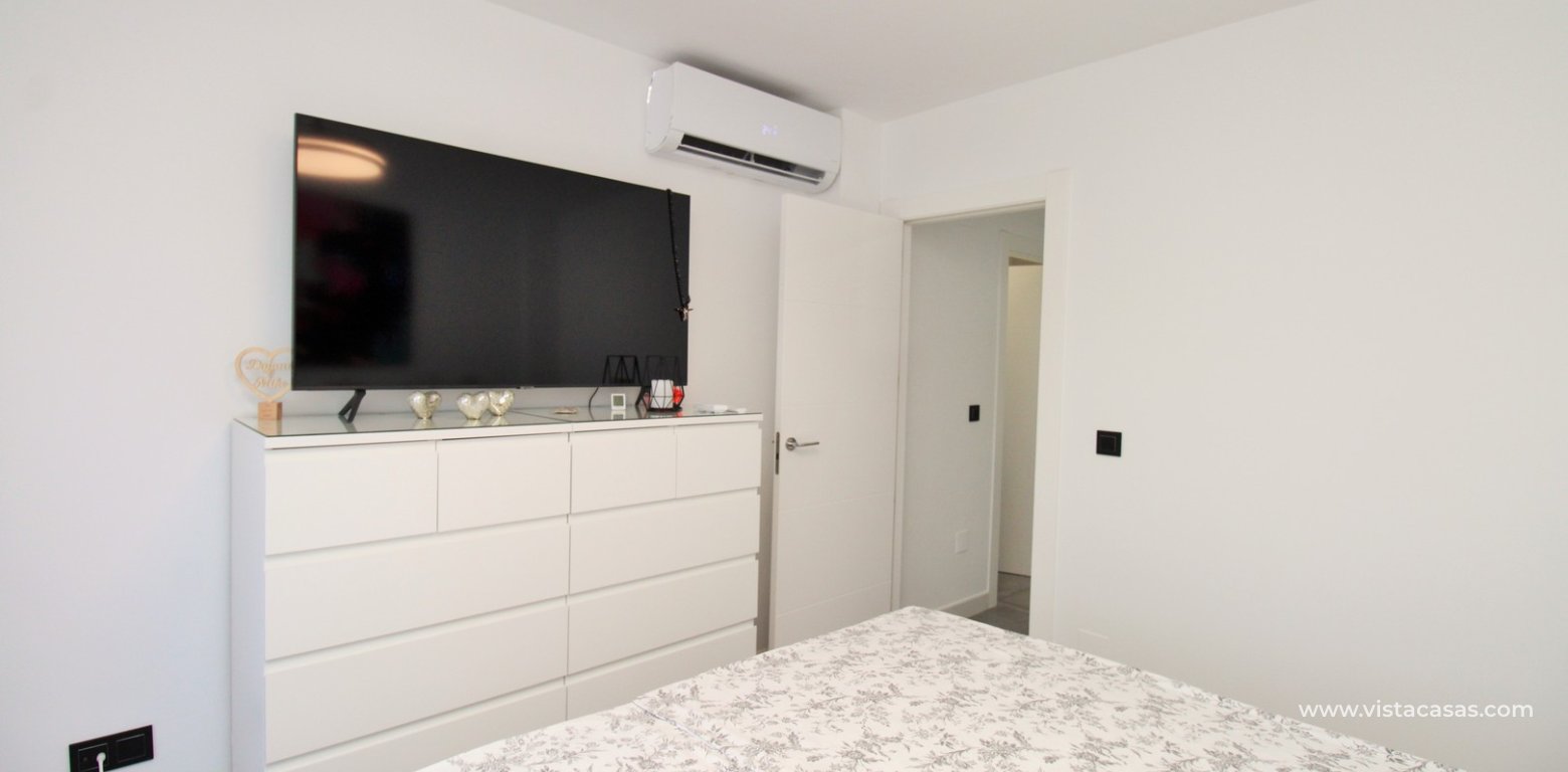 Beachside semi-detached house for sale in Mil Palmeras with private swimming pool master bedroom fitted a/c