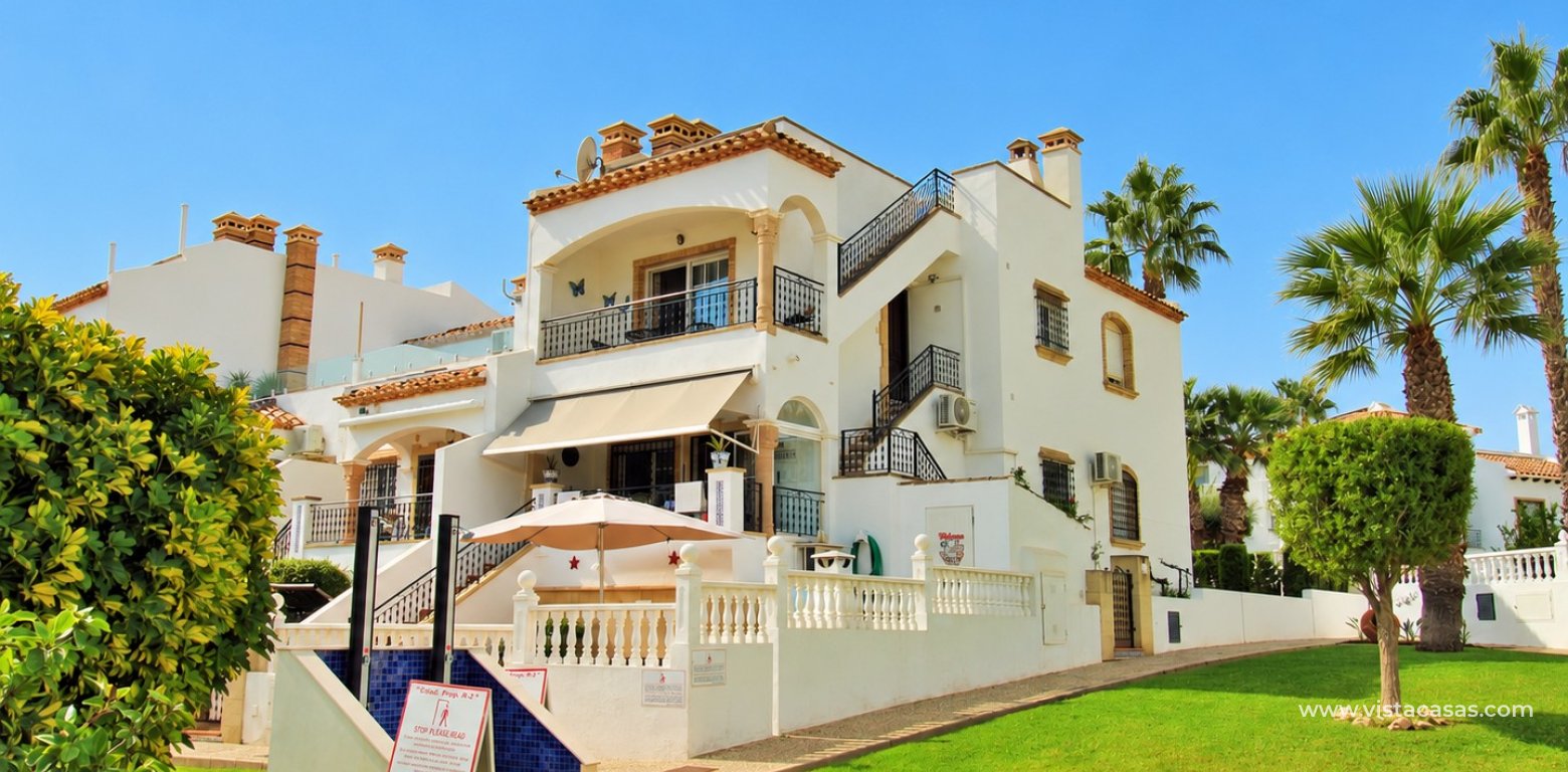 Top floor apartment with sea and pool views in for sale in Las Violetas Villamartin front