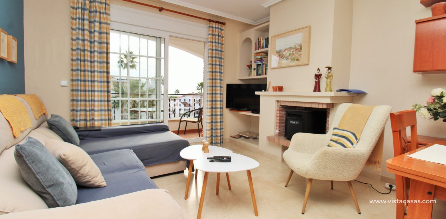 Top floor apartment with sea and pool views in for sale in Las Violetas Villamartin living area
