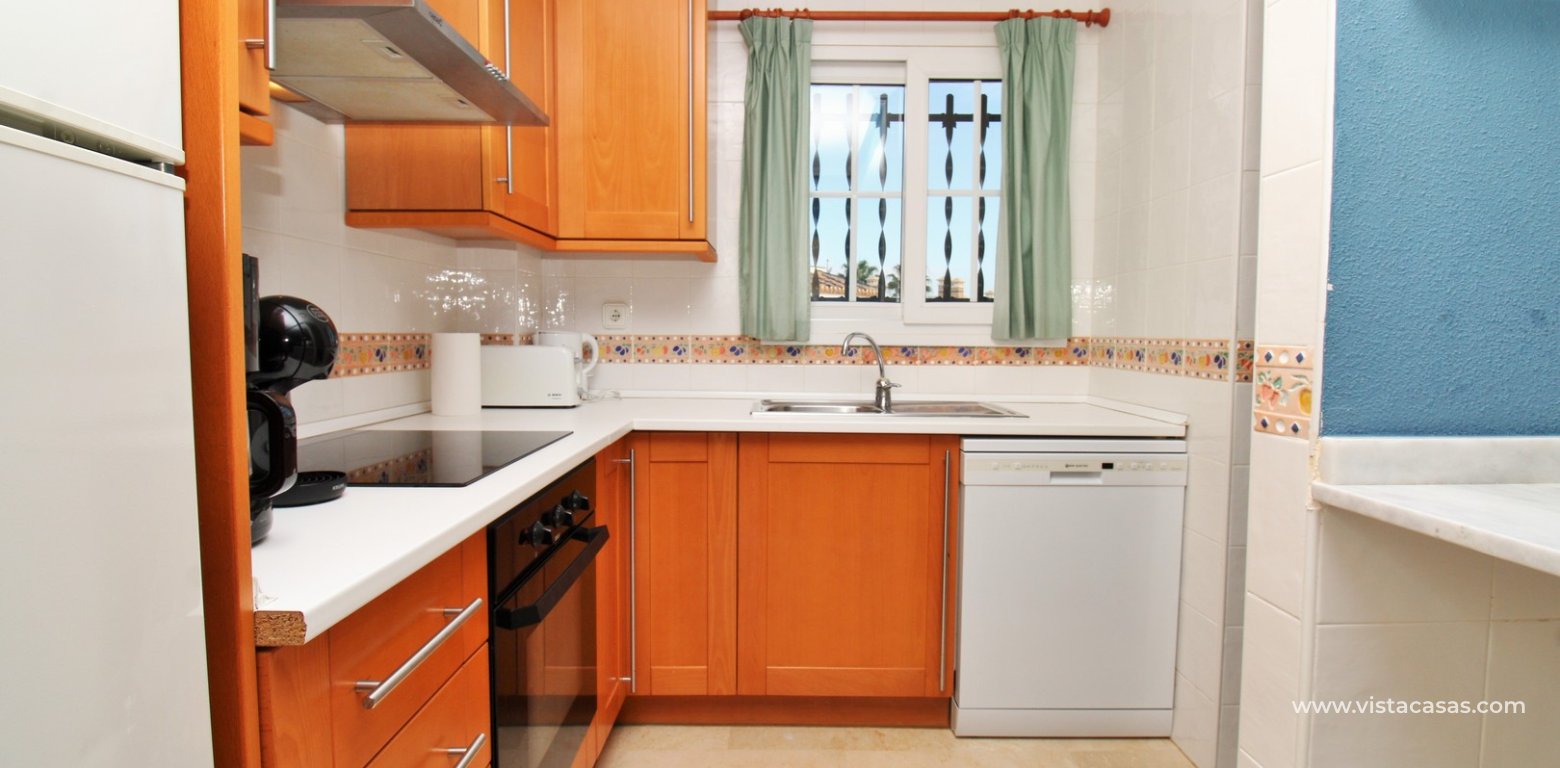 Top floor apartment with sea and pool views in for sale in Las Violetas Villamartin kitchen 3