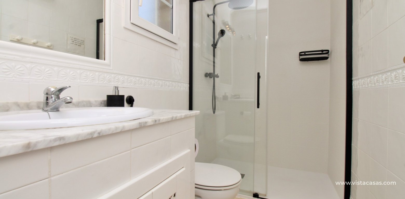 Top floor apartment with sea and pool views in for sale in Las Violetas Villamartin en-suite bathroom