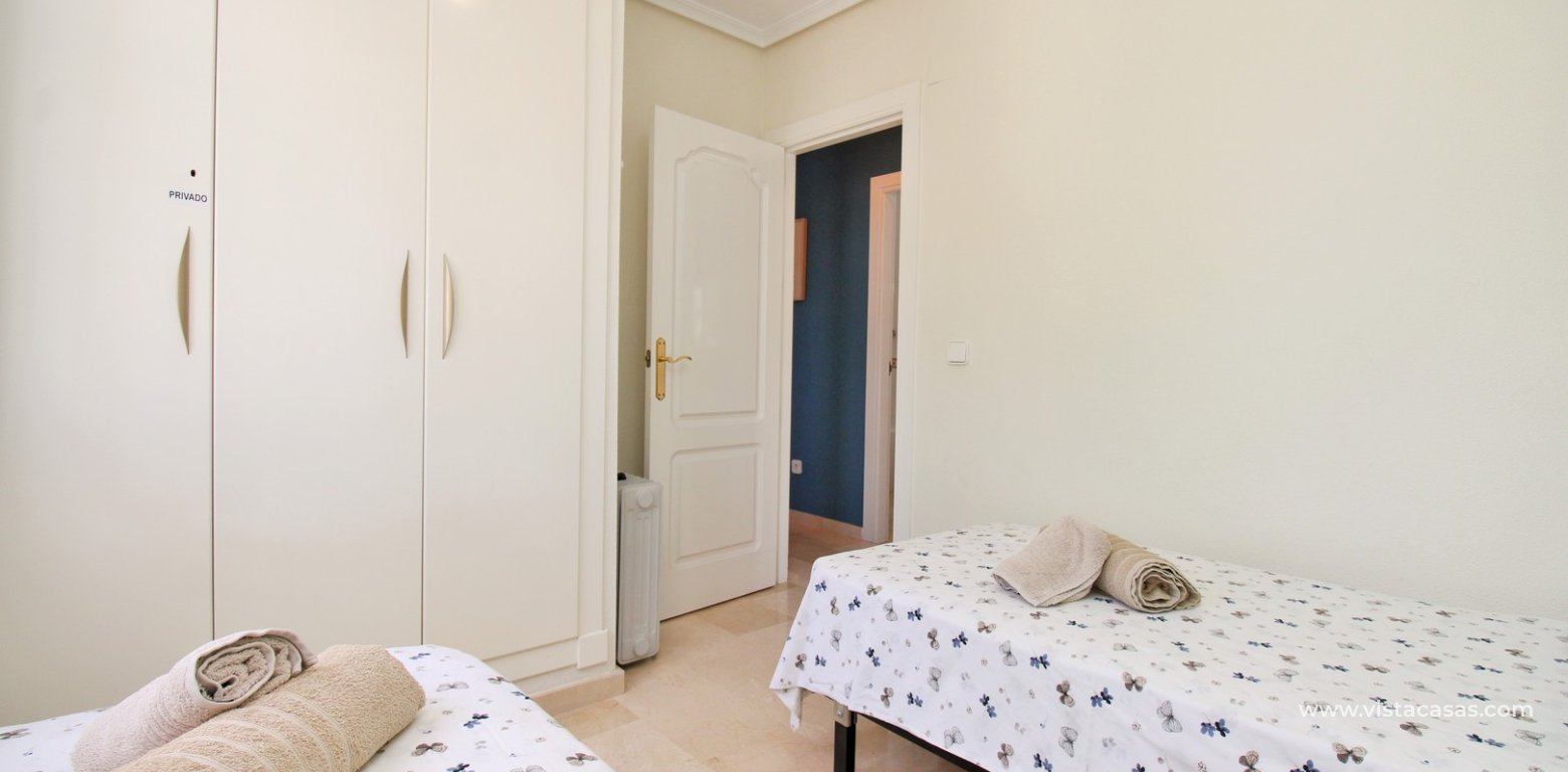 Top floor apartment with sea and pool views in for sale in Las Violetas Villamartin twin bedroom fitted wardrobes