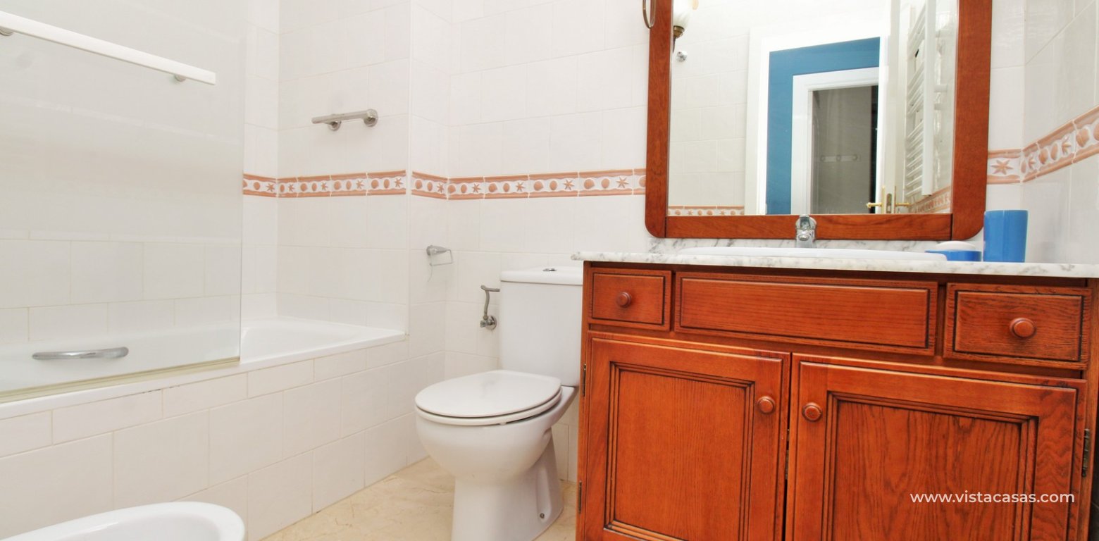 Top floor apartment with sea and pool views in for sale in Las Violetas Villamartin bathroom