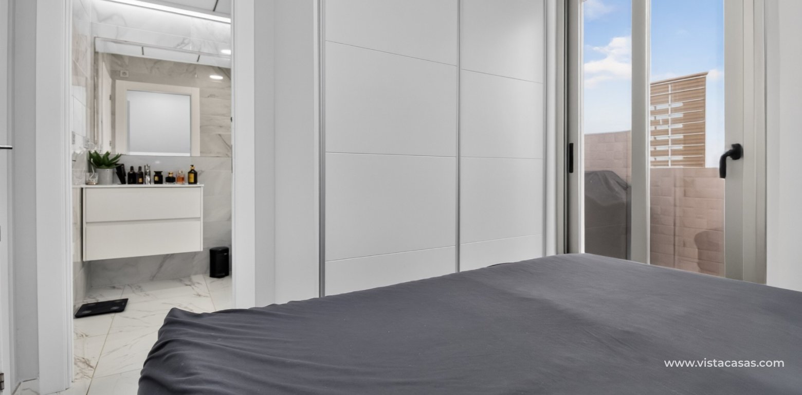 South-facing 4 bedroom villa for sale in Pink Paradise Villamartin master bedroom fitted wardrobes