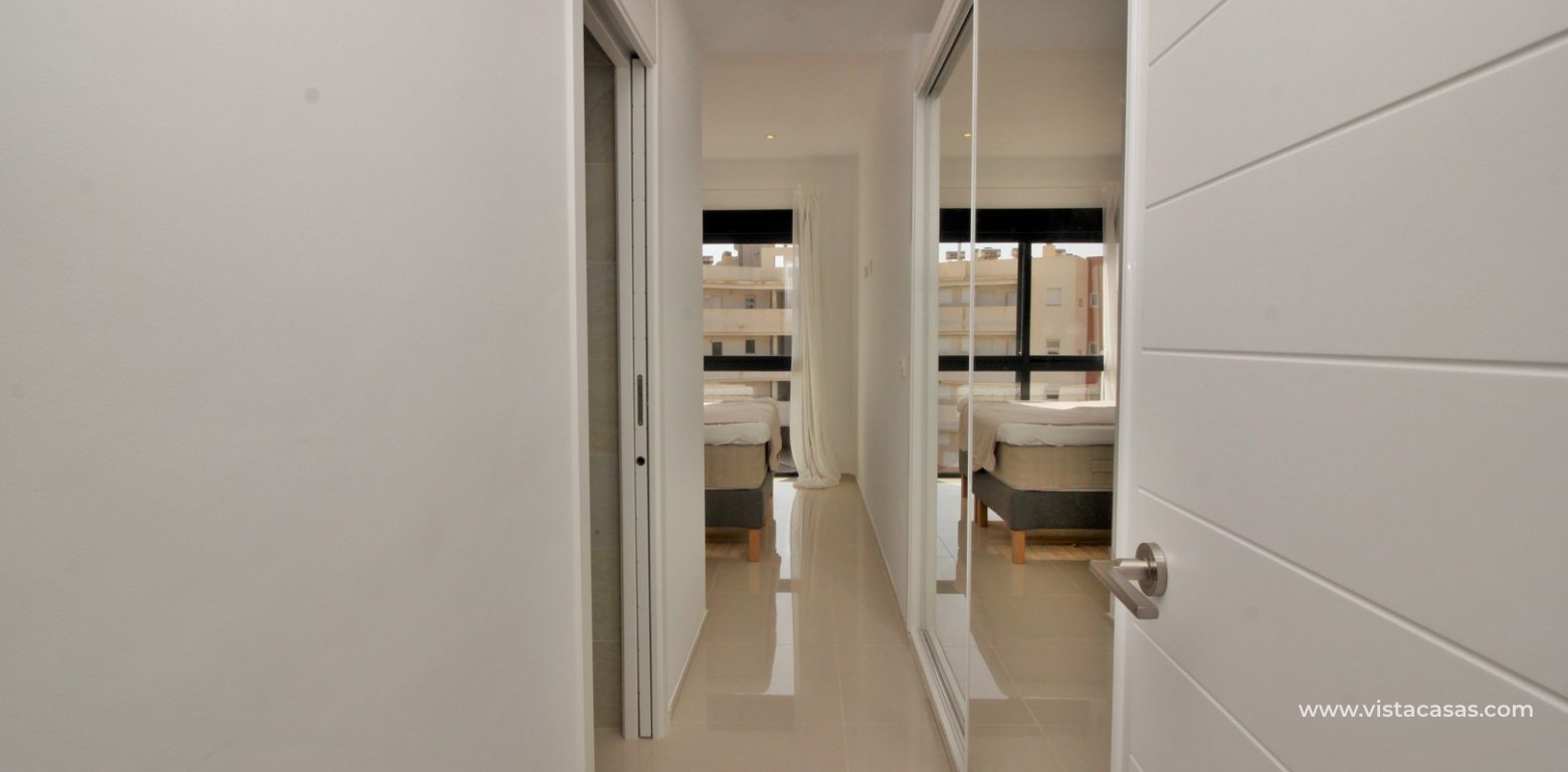 Penthouse apartment for sale Zenia Beach II Los Dolses master bedroom hallway fitted wardrobes