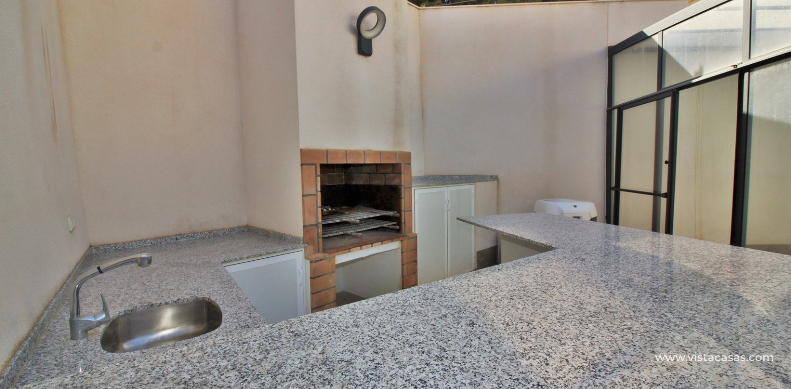 Renovated villa with private heated pool for sale Blue Lagoon Villamartin summer kitchen