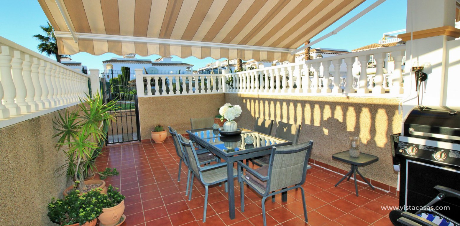 Townhouse for sale overlooking the pool R15 La Ciñuelica Punta Prima tiled garden