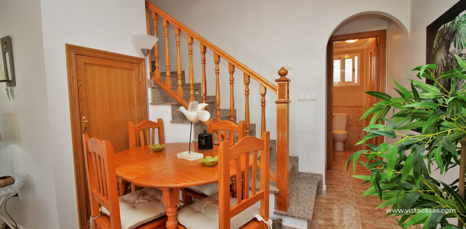 Townhouse for sale overlooking the pool R15 La Ciñuelica Punta Prima dining area