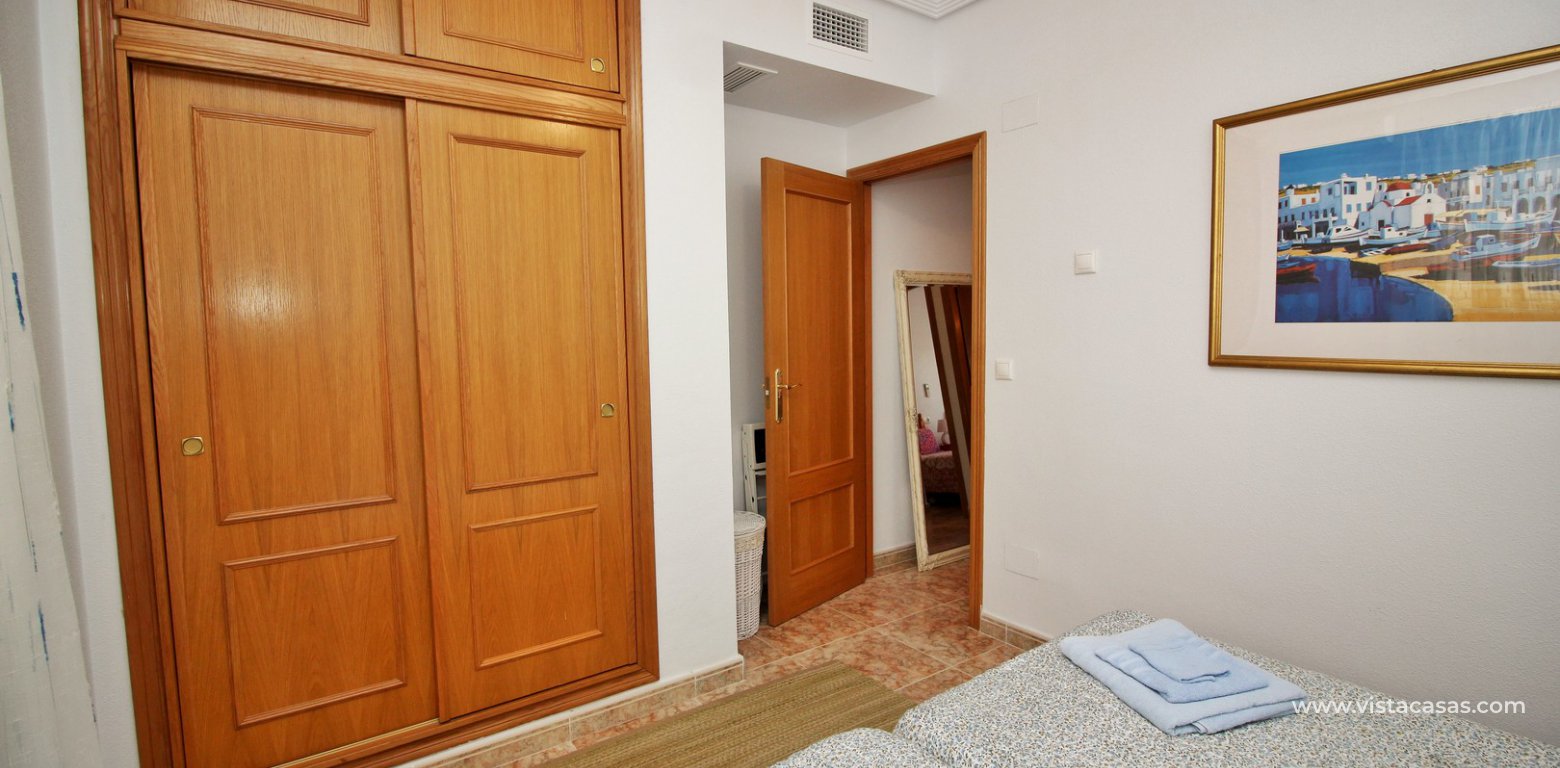 Townhouse for sale overlooking the pool R15 La Ciñuelica Punta Prima master bedroom fitted wardrobes